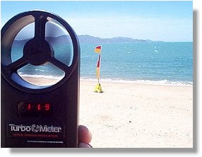 Taking wind speed readings on the Townsville Strand with a hand held meter.